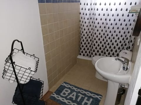 Deluxe Room, 2 Queen Beds | Bathroom | Shower, soap, shampoo, toilet paper
