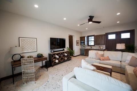 Adjoining recreation room on main level with kitchenette and separate entrance