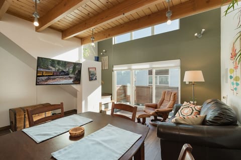 Downtown Durango vacation rental condo within walking distance to downtown. Living room with TV and access to outdoor deck. Queen sleeper sofa.