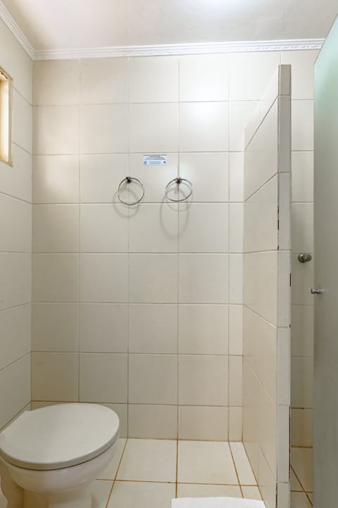 Economy Triple Room, Multiple Beds | Bathroom | Shower, towels, soap, shampoo