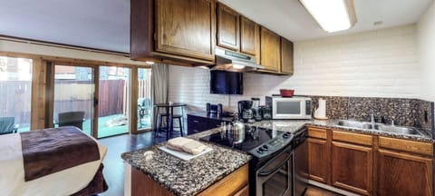 Kitchen stocked, cookware, silverware, plates, utensils and everything you see