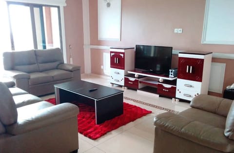 Apartment, 3 Bedrooms | Living area | 32-inch flat-screen TV with cable channels, TV