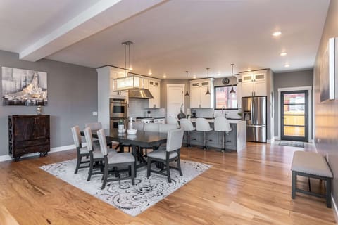 The modern open kitchen & dining room are ready for your next getaway