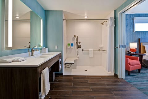 Suite, 1 King Bed, Accessible (Roll-In Shower) | Bathroom | Rainfall showerhead, free toiletries, hair dryer, towels