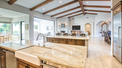 Incredible open views of main living areas from large kitchen w/ panoramic door.