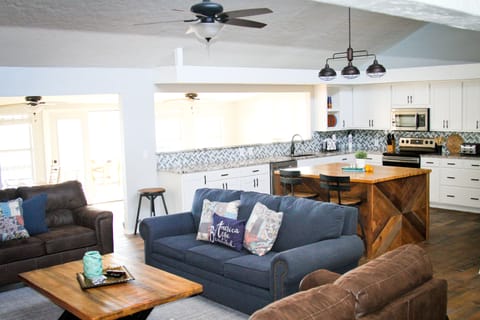 Family room and large kitchen. Stainless appliances and granite countertops.