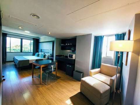 Double Room, Corner | Living area | Flat-screen TV