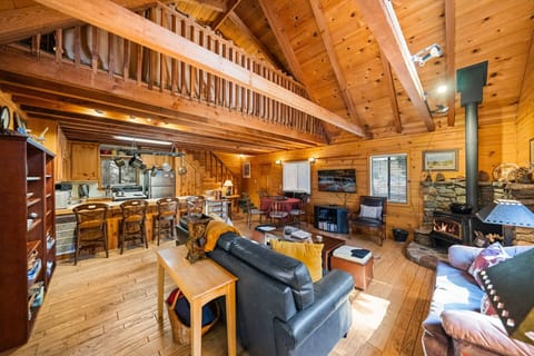 Home features vaulted ceilings, wood burning stove, knotty pine - Home features vaulted ceilings, wood burning stove, knotty pine throughout and cozy cabin decor.