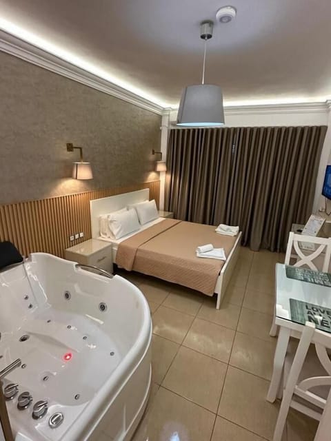 Deluxe Double Room, Hot Tub, Sea View | 1 bedroom, in-room safe, desk, soundproofing