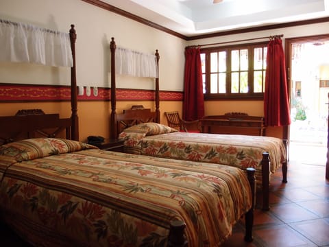 Double Room, 2 Queen Beds | Pillowtop beds, individually decorated, individually furnished, desk