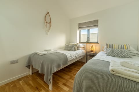 The Stables, St Agnes. Bedroom two with twin beds