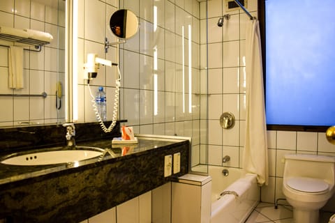 Executive Room King | Bathroom | Free toiletries, heated floors, towels, soap