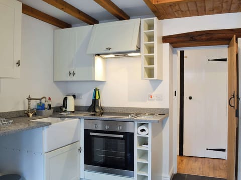 Well equipped compact kitchen area | Noddfa Cottage, Llanfairtalhaiarn, near Abergele