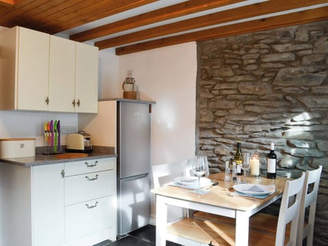 Dining area and adjacent kitchen | Noddfa Cottage, Llanfairtalhaiarn, near Abergele