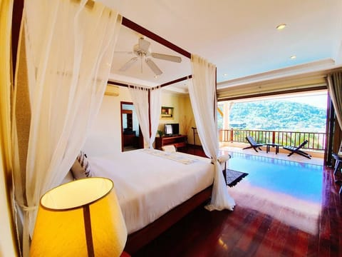 Deluxe Room with Pool View | Blackout drapes, iron/ironing board, free WiFi, bed sheets