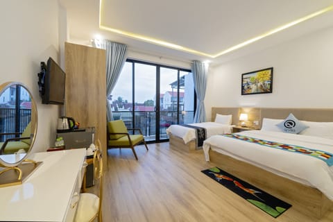 Deluxe Triple Room, Balcony | Minibar, individually decorated, individually furnished, desk