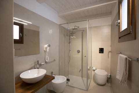 Superior Quadruple Room, Patio | Bathroom | Shower, rainfall showerhead, free toiletries, hair dryer