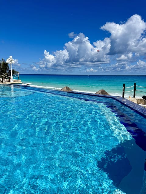 Outdoor pool, pool umbrellas, sun loungers