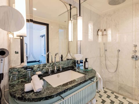 Deep soaking tub, designer toiletries, hair dryer, bathrobes