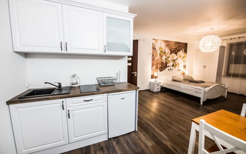 Apartment | Private kitchenette | Fridge, electric kettle, highchair