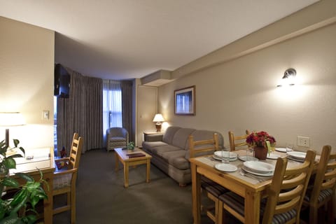 Suite, 1 Bedroom | Living area | TV, fireplace