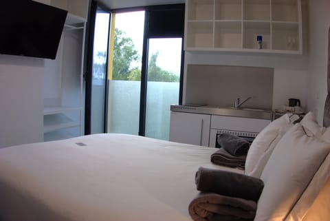 King with City View | Premium bedding, memory foam beds, free WiFi, bed sheets