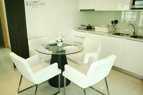 Suite, 2 Bedrooms, Garden View | Private kitchenette | Fridge, stovetop, electric kettle, dining tables