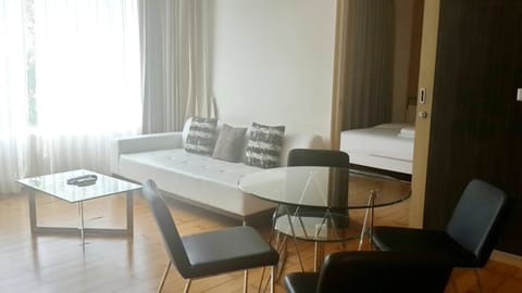 Suite, 1 Bedroom, Garden View | Living area | Flat-screen TV