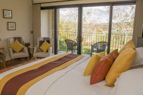 Deluxe Room, 1 King Bed, Balcony | Desk, laptop workspace, iron/ironing board, free WiFi