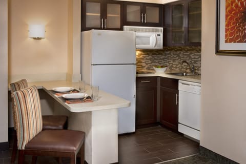 Full-size fridge, microwave, stovetop, dishwasher