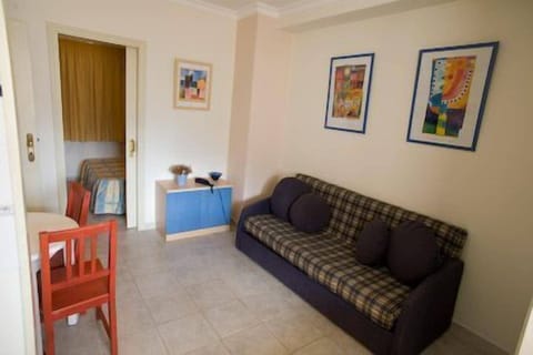 Apartment (2 Adults and 1 child) | Living area | Flat-screen TV