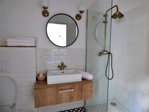 Comfort Room (Gatsby) | Bathroom | Shower, rainfall showerhead, hair dryer, towels