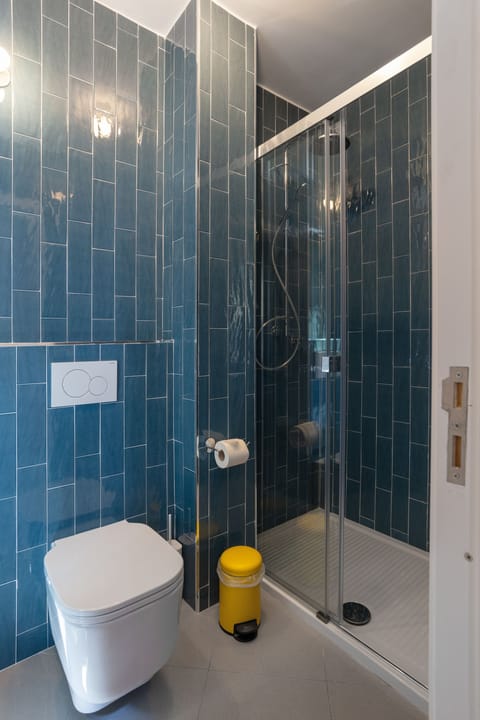 Room, City View (Room 05) | Bathroom | Shower, rainfall showerhead, hair dryer, bathrobes