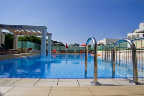 Seasonal outdoor pool, open 9:00 AM to 9:00 PM, pool umbrellas