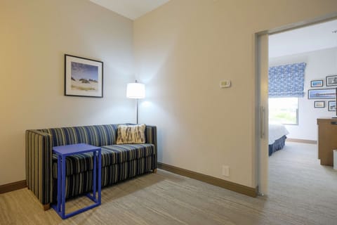 Suite, 1 King Bed, Accessible (Mobility & Hearing, Shower) | Living area | 32-inch flat-screen TV with cable channels, TV