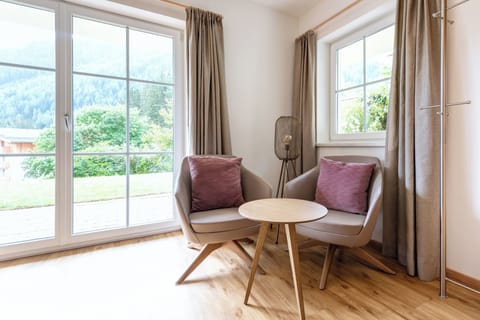 Condo | Living area | 70-cm flat-screen TV with cable channels, LED TV, video-game console