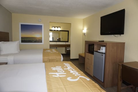 Room, 2 Queen Beds, Non Smoking | Living room | 42-inch flat-screen TV with cable channels, TV