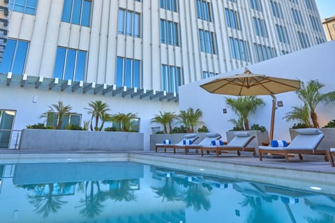 Outdoor pool, open 8:00 AM to 8:00 PM, pool umbrellas, sun loungers