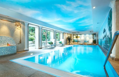 Indoor pool, open 7:00 AM to 10:00 PM, sun loungers