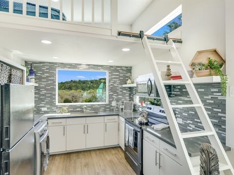 Ladder to loft. Two foam twin mattresses on loft