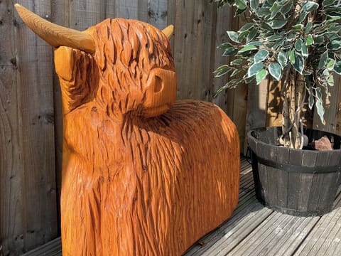 Decking area to the rear of the cottage | Mile End Cottage, Inverness