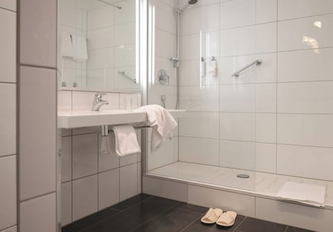 Eco-friendly toiletries, hair dryer, slippers, towels