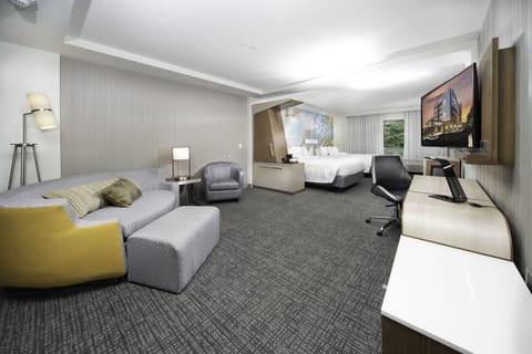 Studio Suite, Multiple Beds | Living area | 55-inch flat-screen TV with cable channels, TV, pay movies