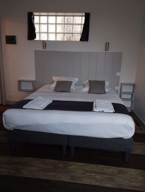 Desk, iron/ironing board, bed sheets