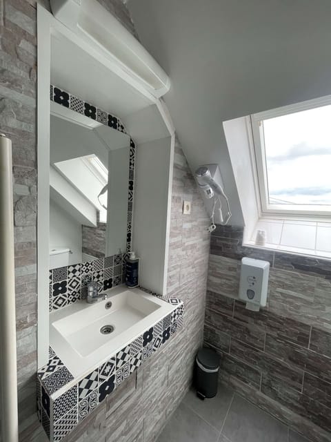 Desk, iron/ironing board, bed sheets