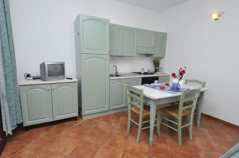 Apartment, 1 Bedroom | Private kitchen | Fridge, stovetop, highchair, cookware/dishes/utensils