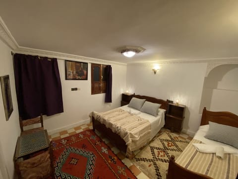 Triple Room | Blackout drapes, cribs/infant beds, free WiFi, bed sheets