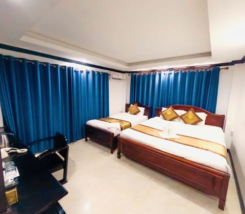 Deluxe Triple Room With Balcony | Free minibar items, in-room safe, laptop workspace, free WiFi