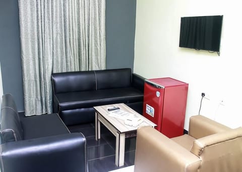 Executive Double Room | Living area | 24-inch flat-screen TV with satellite channels, TV