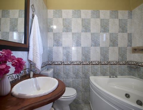 Suite | Bathroom | Deep soaking tub, rainfall showerhead, hair dryer, towels